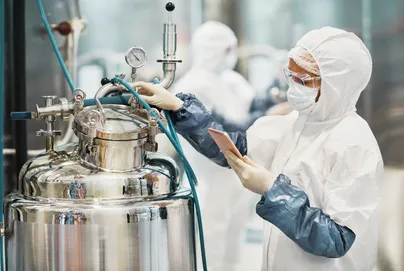 Photograph of medical laboratory technician monitoring laboratory equipment